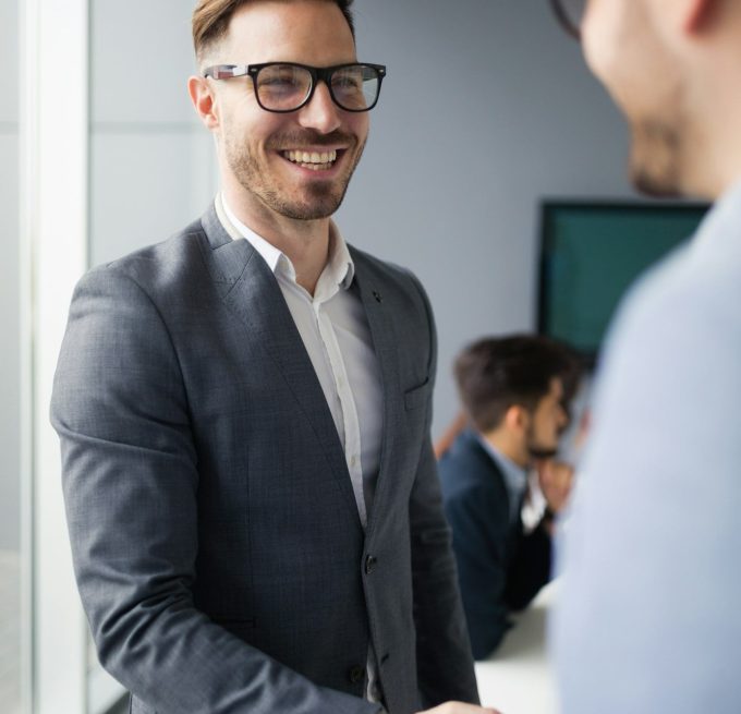 Business people shaking hands in modern office
