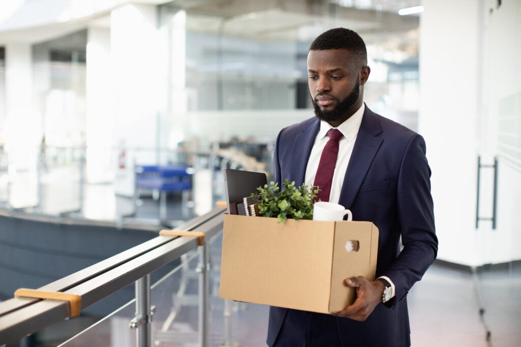 Terminated african american guy in suit lost his job