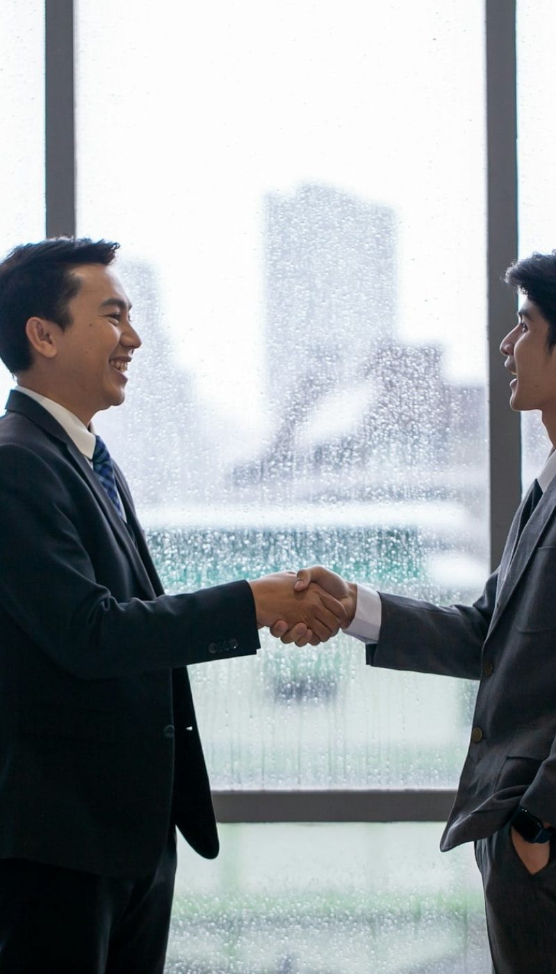 Teamwork Deal Cooperation Partnership business people shaking hands.