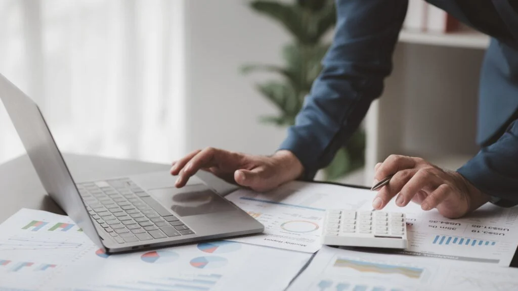 Business men are looking at the company's financial documents to analyze problems and find solutions