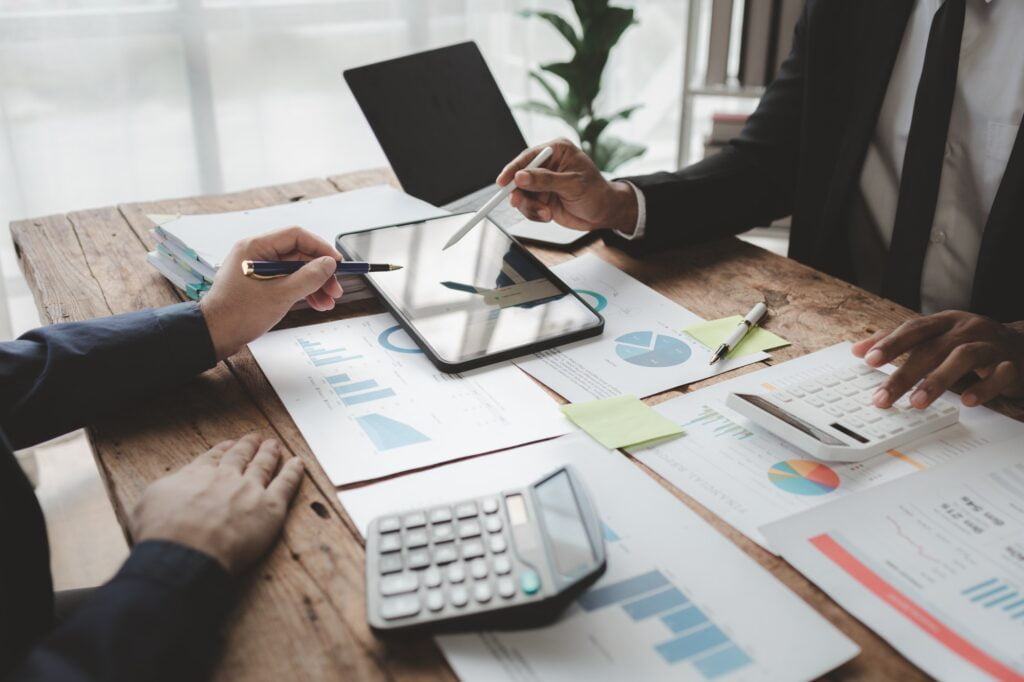 Businessmen are attending a meeting about finances, Discussing tax payments in the conference room,